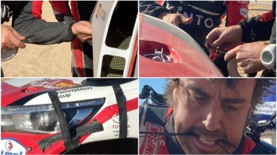 Alonso plays his own mechanic on the Dakar